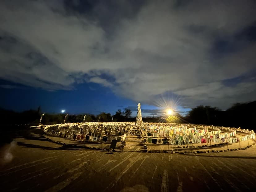Circular desert installation lit up at night