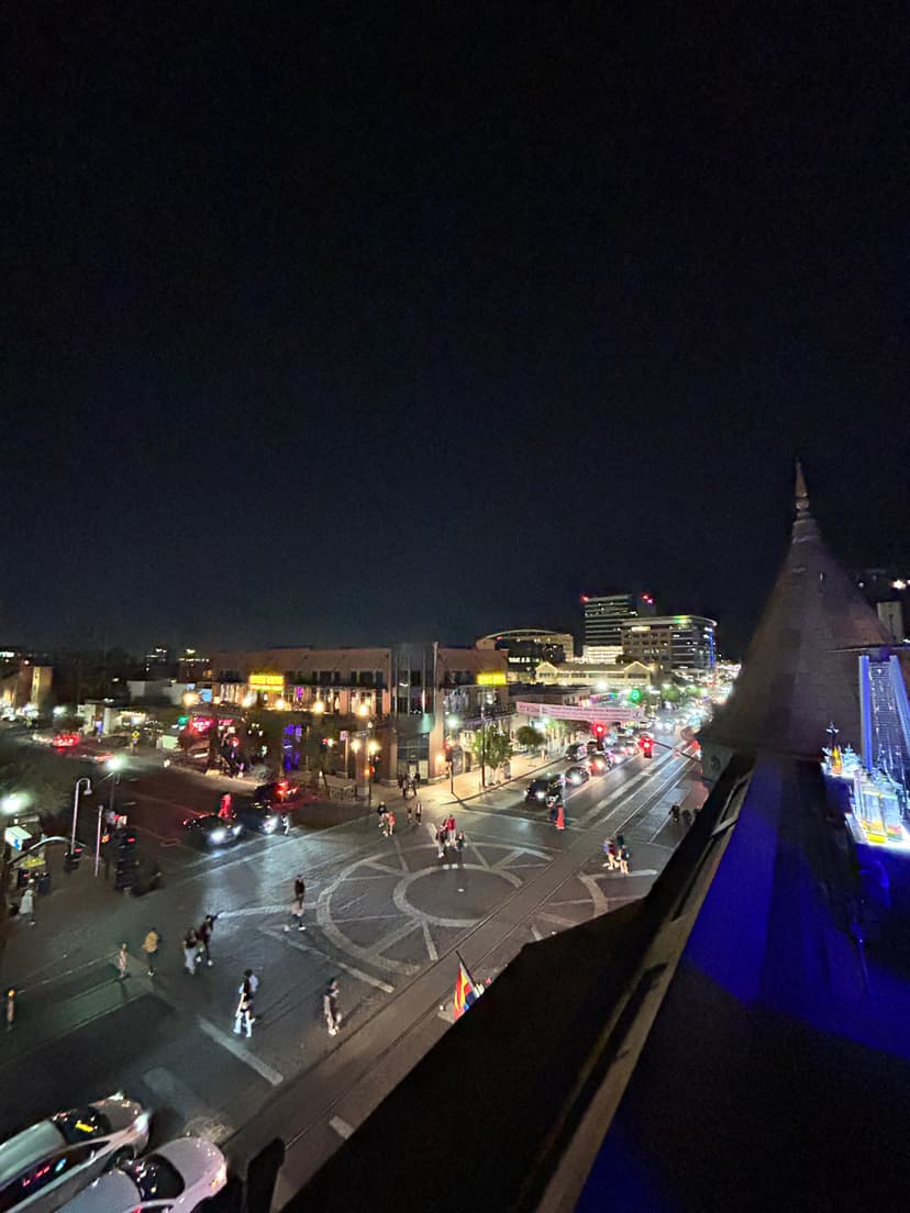 Vibrant downtown streets at night from above