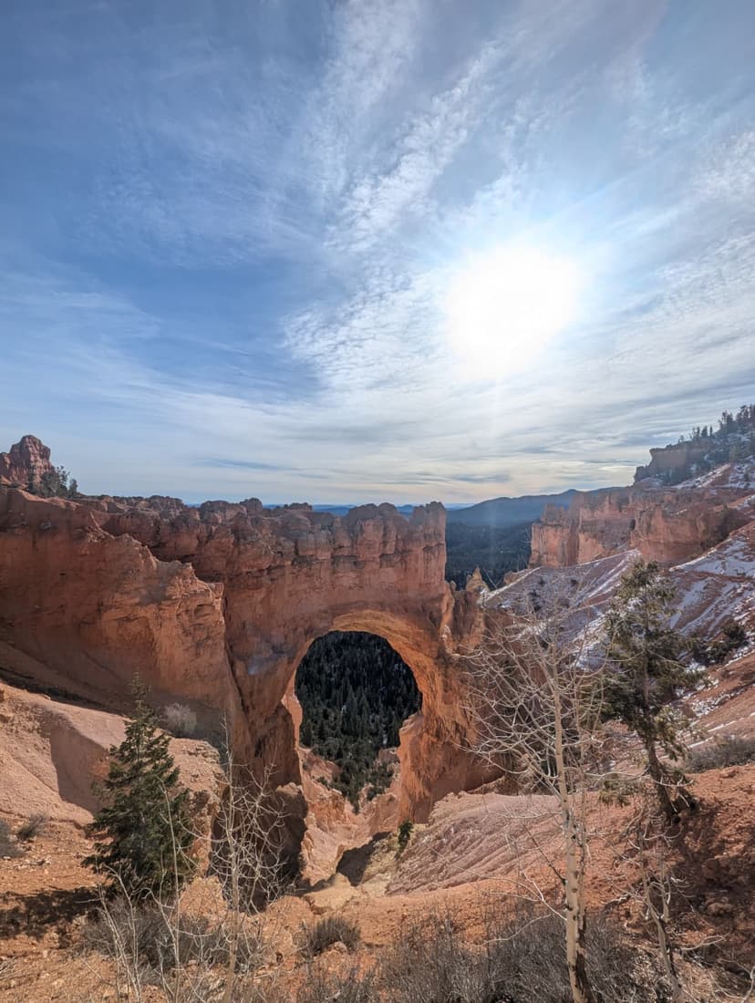 Natural rock arch formation at Bryce Canyon under bright sunlight
