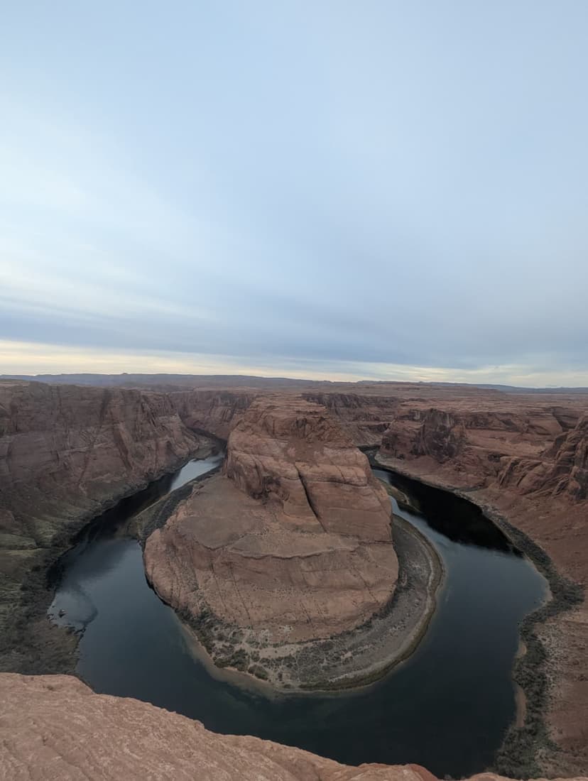 Aerial view of Horseshoe Bend with the Colorado River curving around red cliffs