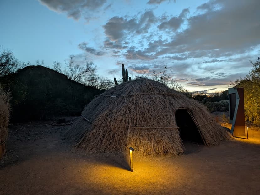 Traditional desert dwelling illuminated warmly at dusk