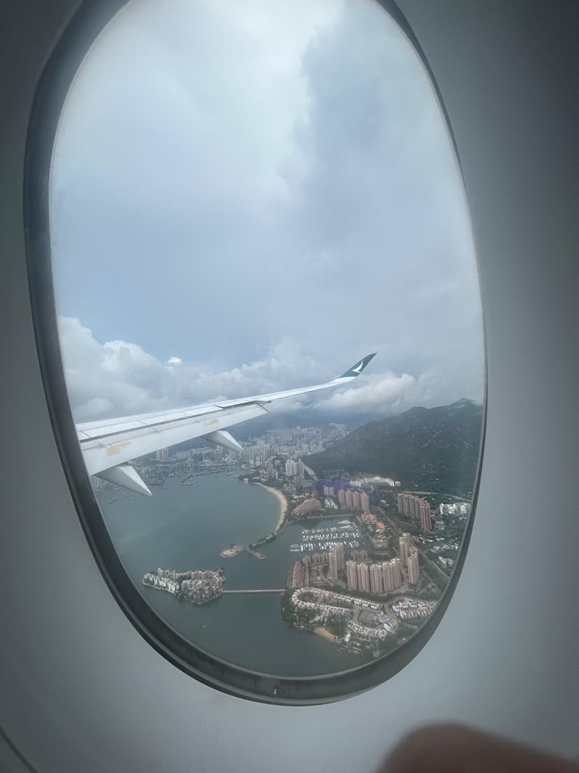 City and coastline view from airplane window approaching California