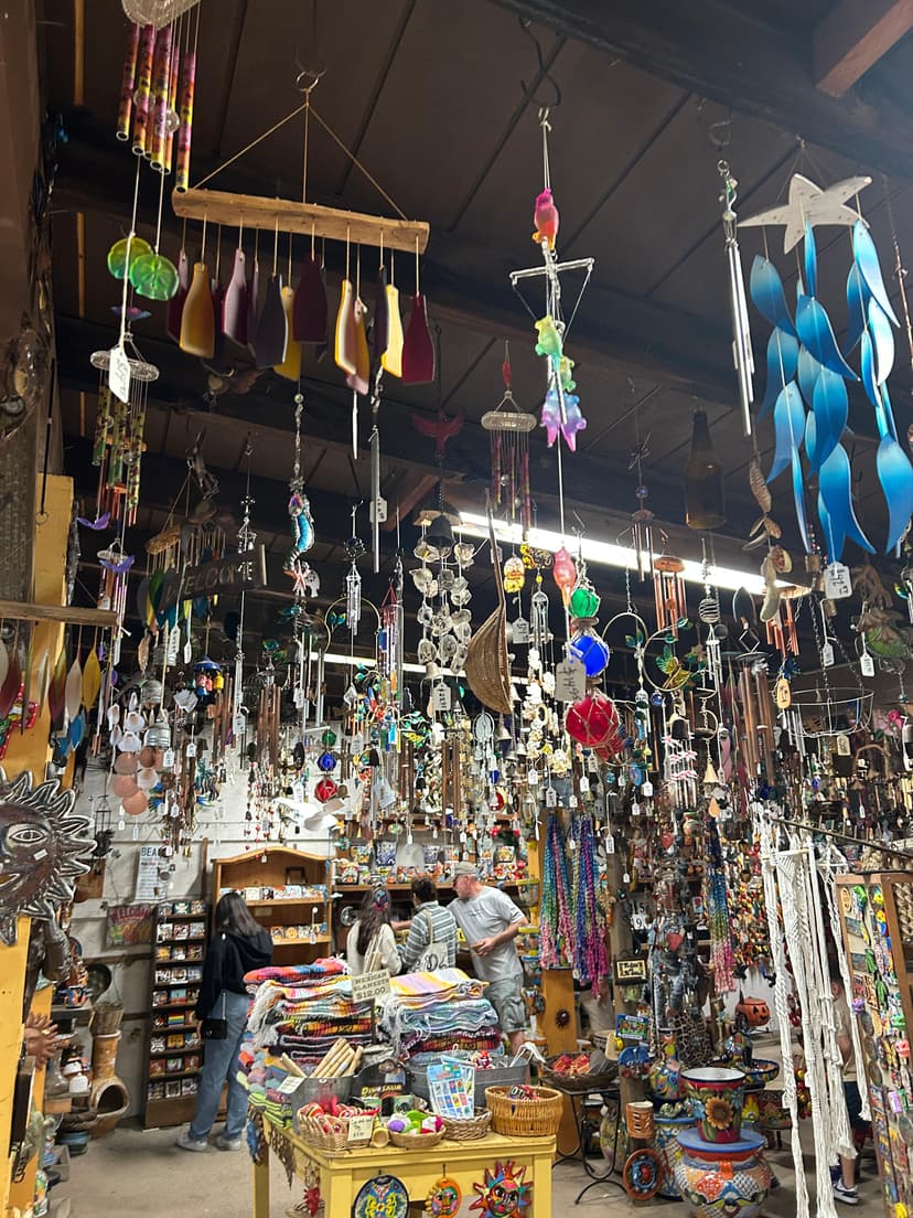 Vibrant gift shop filled with colorful hanging ornaments, crafts, and trinkets in Old Town San Diego