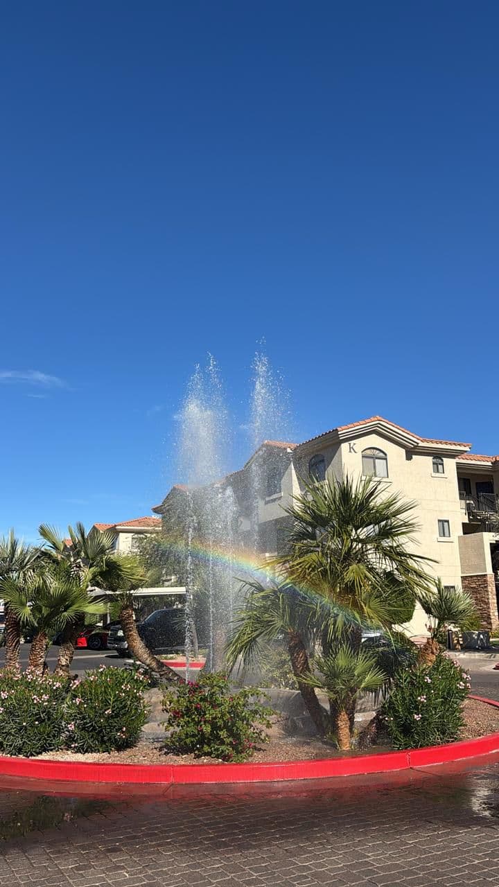 Fountain rainbow on a bright sunny day
