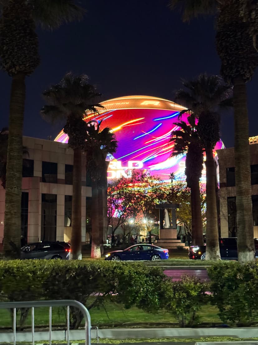 Colorful light display on the Sphere surrounded by palm trees